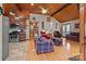 Open concept living area with kitchen and access to laundry room at 746 Springwood Dr # 14&15, Mount Gilead, NC 27306