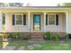 Close up view of the front door, showing landscaping and porch at 2005 Hilton Way Rd, Lancaster, SC 29720