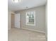 Cozy bedroom with window and neutral decor at 2465 Palmdale Walk Dr, Fort Mill, SC 29708