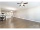 Hardwood floor living room with ceiling fan and open floor plan at 2465 Palmdale Walk Dr, Fort Mill, SC 29708