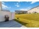 Private backyard with grassy area and patio, perfect for grilling at 2465 Palmdale Walk Dr, Fort Mill, SC 29708