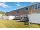 Rear view of the townhome, showing patio and lawn at 2465 Palmdale Walk Dr, Fort Mill, SC 29708