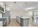 Open concept kitchen with island, granite countertops, and stainless steel appliances at 2465 Palmdale Walk Dr, Fort Mill, SC 29708