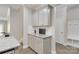 Kitchen with built-in workspace, granite countertops, and gray cabinets at 2465 Palmdale Walk Dr, Fort Mill, SC 29708