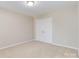 Well-lit bedroom with double doors and carpet at 2465 Palmdale Walk Dr, Fort Mill, SC 29708