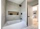 Relaxing bathroom with soaking tub, a shower, and modern tile at 504 Circle Dr, Shelby, NC 28150