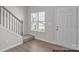 Bright entryway with hardwood floor, staircase, and window at 5332 Cherrie Kate Ct # 1703, Stanley, NC 28164