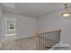 Bright upper landing with carpeting and access to bedrooms at 5332 Cherrie Kate Ct # 1703, Stanley, NC 28164