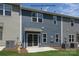 Rear exterior view of townhome with private patio at 5332 Cherrie Kate Ct # 1703, Stanley, NC 28164