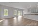 Modern kitchen with gray cabinets, island, and sliding glass doors at 5332 Cherrie Kate Ct # 1703, Stanley, NC 28164