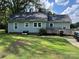 Rear view of the home, showing a deck and yard at 2214 Old Concord Rd, Salisbury, NC 28146