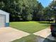 Large backyard with grassy area and trees at 2214 Old Concord Rd, Salisbury, NC 28146