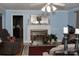 Living room with fireplace, hardwood floors, and a large window at 3021 Davis Park Rd, Gastonia, NC 28052