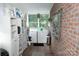 Laundry room with washer, dryer, and built-in shelving at 3021 Davis Park Rd, Gastonia, NC 28052