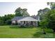 Brick ranch house with a large covered porch at 3021 Davis Park Rd, Gastonia, NC 28052