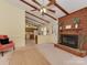 Living area with brick fireplace and view to kitchen at 200 Linville Dr, Matthews, NC 28105