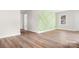 Bright living room with light wood floors and an accent wall at 16 Hill St, York, SC 29745