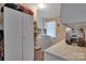 Functional laundry room with washer, dryer, and storage at 700 Wood St, Troy, NC 27371