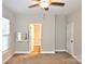 Bedroom with carpet, ceiling fan and access to bathroom at 924 Marshville Olive Branch Rd, Marshville, NC 28103