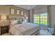 Spacious main bedroom with large window and backyard view at 244 Giant Oak Ave, Statesville, NC 28677