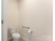 Clean bathroom with toilet, shower, and grab bar at 625 Latrobe Dr, Iron Station, NC 28080