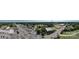 Wide aerial view showing the property and surrounding commercial areas at 110 Sims Pkwy, Harrisburg, NC 28075