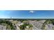 Wide aerial view of a neighborhood, showing house and surrounding businesses at 110 Sims Pkwy, Harrisburg, NC 28075
