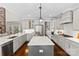 Modern kitchen with large island, stainless steel appliances, and white cabinets at 6135 Chimney Bluff Rd, Lancaster, SC 29720