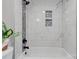 Clean white tile shower with mosaic accents at 607 Ligon St, Shelby, NC 28150