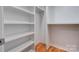 Bright white pantry with ample shelving for storage at 607 Ligon St, Shelby, NC 28150