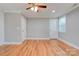 Bright bedroom with hardwood floors, ceiling fan, and ample closet space at 607 Ligon St, Shelby, NC 28150