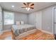 Spacious bedroom with hardwood floors and ceiling fan at 607 Ligon St, Shelby, NC 28150