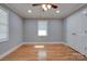 Spacious bedroom with hardwood floors and double doors at 607 Ligon St, Shelby, NC 28150