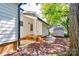 Small back porch with stone steps leading to the backyard at 607 Ligon St, Shelby, NC 28150