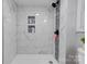 Walk-in shower with marble tile and accent mosaic at 607 Ligon St, Shelby, NC 28150