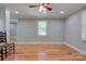Hardwood floor living room with chair and large window at 607 Ligon St, Shelby, NC 28150