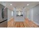 Open concept kitchen with stainless steel appliances and hardwood floors at 607 Ligon St, Shelby, NC 28150