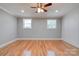 Bedroom with hardwood floors, ceiling fan and wainscoting at 607 Ligon St, Shelby, NC 28150
