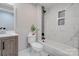 Bathroom with white tile, bathtub and shower at 607 Ligon St, Shelby, NC 28150