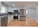 Updated kitchen with white cabinets, granite countertops and stainless steel appliances at 607 Ligon St, Shelby, NC 28150