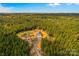 Aerial view of property showcasing a detached shop and surrounding trees at 2710 Wyatt Grove Church Rd, Richfield, NC 28137