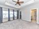 Large main bedroom with carpeted floor, walk in closet and ensuite bathroom at 657 Crudent Rd, Tega Cay, SC 29708