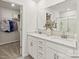 Double vanity bathroom with a large mirror and walk-in closet at 537 Mountain View Dr, Monroe, NC 28110