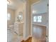 Renovated bathroom with white vanity, tile floor, and view to bedroom at 203 Peyton St, Chester, SC 29706