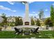 Outdoor fireplace with seating area, perfect for relaxing evenings at 3217 Maymont Pl, Charlotte, NC 28205