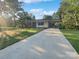 Front view of a single story home with driveway at 1525 Vanderlip Dr, Gastonia, NC 28052