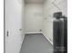 Laundry room with shelving and water softener at 1525 Vanderlip Dr, Gastonia, NC 28052