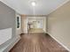 Open living room with kitchen view and hardwood floors at 1525 Vanderlip Dr, Gastonia, NC 28052