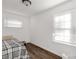 Simple bedroom with wood floors and window coverings at 412 E Jefferson St, York, SC 29745