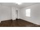 Simple bedroom with hardwood floors and built-in closet at 412 E Jefferson St, York, SC 29745